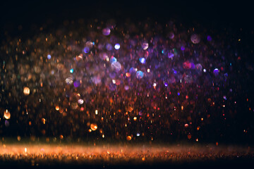 background of abstract glitter lights. purple and blue