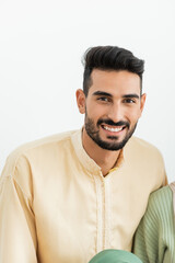 young muslim man looking at camera at home.