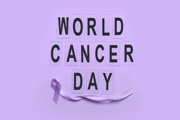 Text WORLD CANCER DAY and awareness ribbon on color background