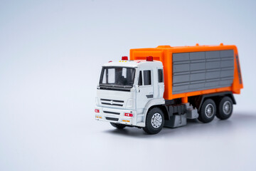 Toy car garbage truck with orange body, on a white background