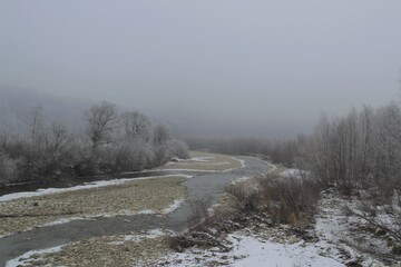 Obraz na płótnie Canvas winter river in fog