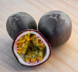 Passion fruit. Exotic fruits - whole and half. The benefits of consuming the fruit of passion - concept.