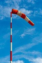 colorful windsock or windbag, wind direction indicator. durable red and white textile tube