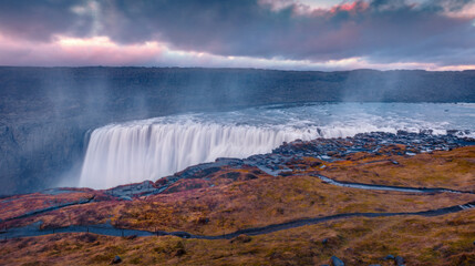 Aerial summer view of most powerful waterfall in Europe - Dettifoss. Unbelievable sunrise in Jokulsargljufur National Park, Iceland. Traveling concept background.