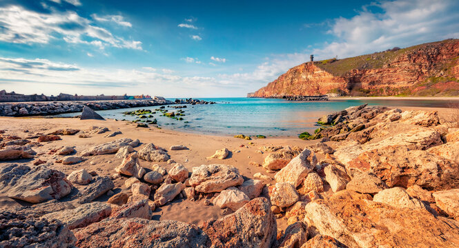 Picturesque spring seascape of Black sea. Red cliffs on Bolata beach. Wonderful outdoor scene of Bulgaria, Europe. Traveling concept background..