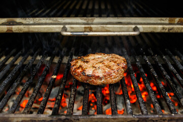 Beef burger for hamburger on barbecue flame grill
