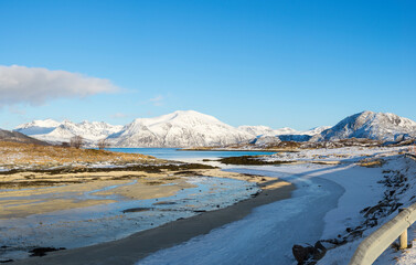 View at the ocean and the fjord in the Atlantic Ocean with a snowy icy river in the polar area and...