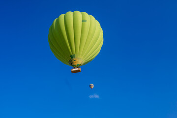 Green balloon with basket