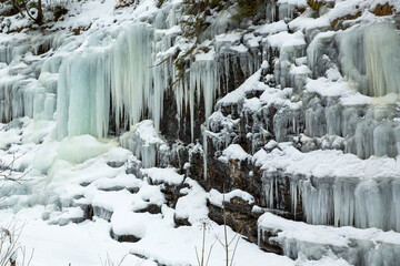 Fototapeta na wymiar Small frozen waterfalls in the mountains, Slovakia