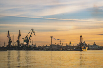 Fototapeta na wymiar Amazing view of the shipyard in Gdansk during the sunset. View from Nowy Port.