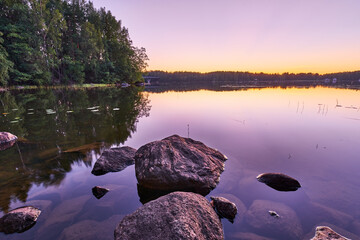 Beautiful purple dusk at calm lake