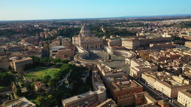 Aerial drone video of Saint Peter's gardens of world's largest church -Basilica of St. Peter's, Vatican and iconic Capella Sistine, Rome, Italy