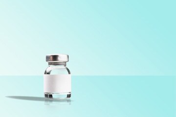 COVID-19 VACCINE for new strain. Ampoule on an abstract light background. Concept new variant of...