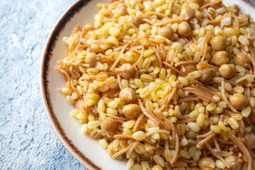Traditional delicious Turkish food; bulgur pilaf with chickpea (Turkish name; nohutlu bulgur pilavi)