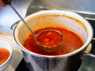 borscht in a saucepan on the stove .home cooking