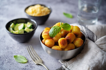 Fried potato gnocchi with cheese filling