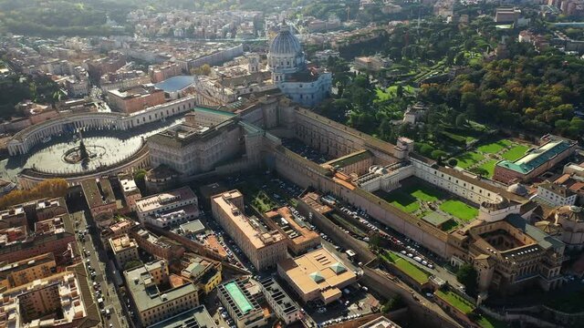 Aerial drone video of Saint Peter's gardens of world's largest church -Basilica of St. Peter's, Vatican and iconic Capella Sistine, Rome, Italy