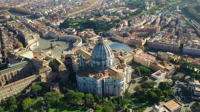 Aerial drone video of Saint Peter's gardens of world's largest church -Basilica of St. Peter's, Vatican and iconic Capella Sistine, Rome, Italy