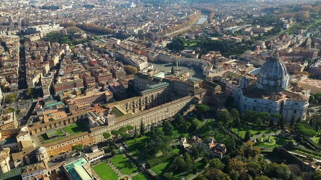 Aerial drone video of Saint Peter's gardens of world's largest church -Basilica of St. Peter's, Vatican and iconic Capella Sistine, Rome, Italy