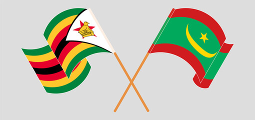 Crossed and waving flags of Zimbabwe and Mauritania