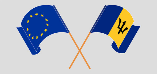 Crossed and waving flags of the European Union and Barbados