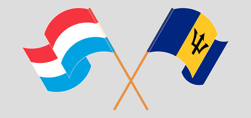 Crossed and waving flags of Luxembourg and Barbados