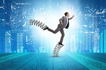 Businessman jumping high on springs