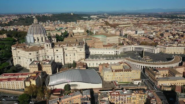 Aerial drone video of Saint Peter's gardens of world's largest church -Basilica of St. Peter's, Vatican and iconic Capella Sistine, Rome, Italy