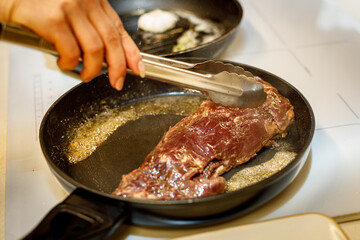 Beef tenderloin fried in a pan.