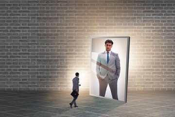 Young businessman in alter ego concept