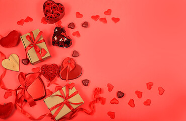 Concept for Valentine's Day or Women's Day, banner. Greeting card, hearts and gift boxes on a red background, space for text, congratulations on the holiday, birthday,