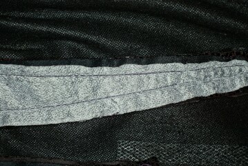 black fabric texture from crumpled clothes with white wide  stripe