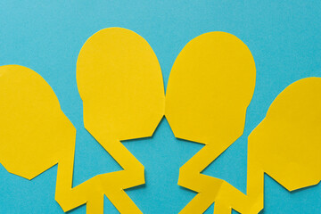 roundish yellow paper shapes on a bright blue background