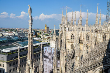 Spires overlooking city, seen since the terrace situated on the roof of the Milan Cathedral (Duomo di Milano), Italy