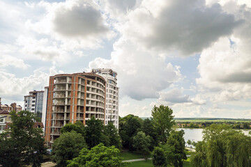 Aerial view of tall residential apartment building under construction. Real estate development.