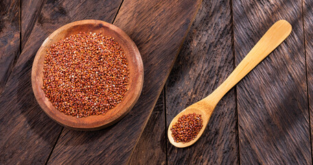 Red quinoa seeds in bowl - Chenopodium quinoa