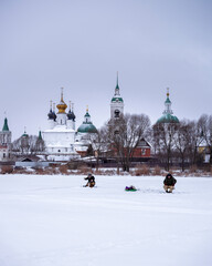 People fishing in frozen river. Rostov, Russia