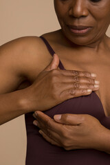 Close-up of woman doing breast cancer self check