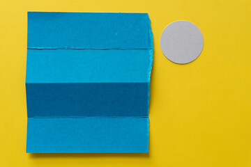 blue and yellow paper with circle