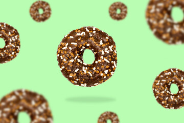 Glazed brown sweet sugar chocolate doughnut donut dessert on gradient green pastel background. Creative minimal blurred selective focus collage food concept