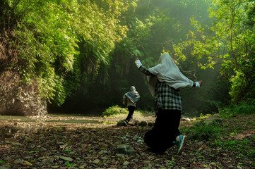 Muslimah girl running in nature