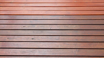 Fototapeta premium Brown wooden plank floor arranged horizontally