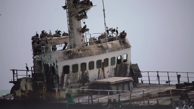 Sunken trawler, shipwreck. Old rusty metal ship Zeila at Skeleton Coast Namibia.