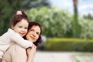 Naklejka premium Happy mother having fun with her daughter outdoor, Family and love concept