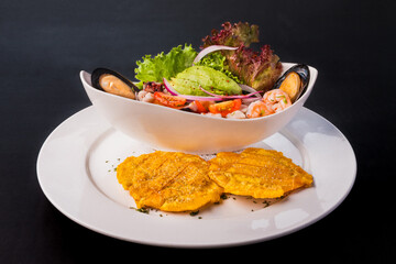 Gourmet clam ceviche with fried plantains Seafood