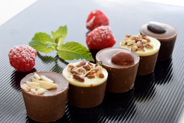 Assorted Chocolates and Raspberries on Black Dish, Japanese Image