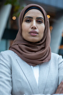 UK, London, Portrait of businesswoman in hijab standing in city
