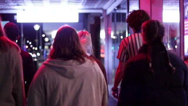 Group of Young People walking at  Night