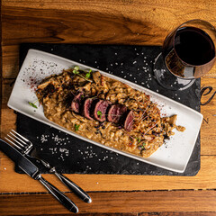 Beef tenderloin with gourmet risotto and wine