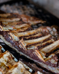 ribs Of Meat Grilling On Fire